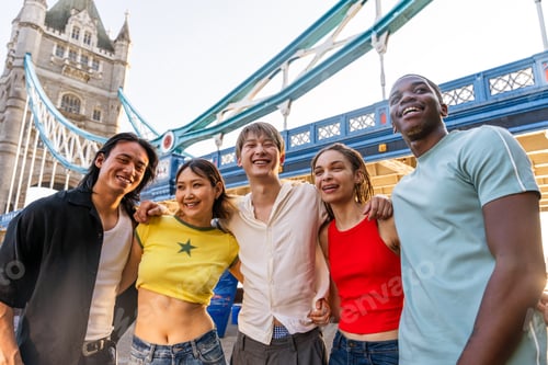 Preview: Multiracial group of happy young friends bonding in London