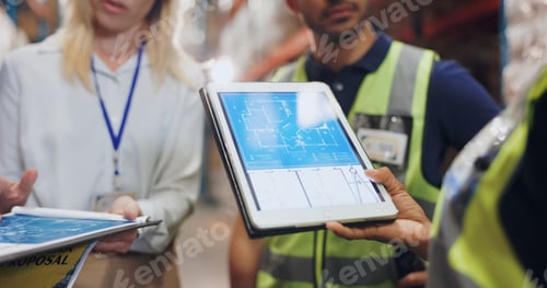 Preview: Hands, architect and tablet for blueprint in logistics warehouse for building, design and expansion