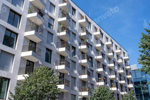 Preview: White apartment building with many small balconies