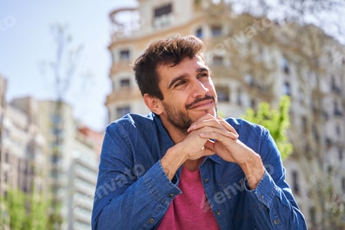 Preview: smiling man posing with folded hands