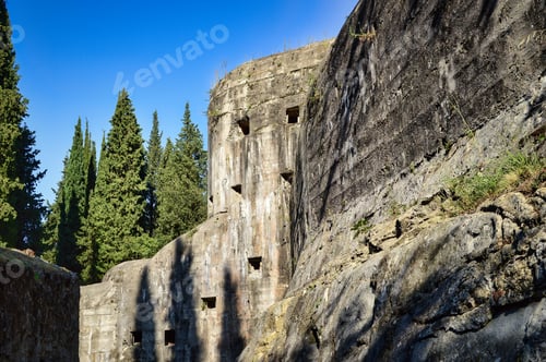 Preview: ancient battery on Monte Brione, Italy with stone walls, steps, windows, blue sky, trees