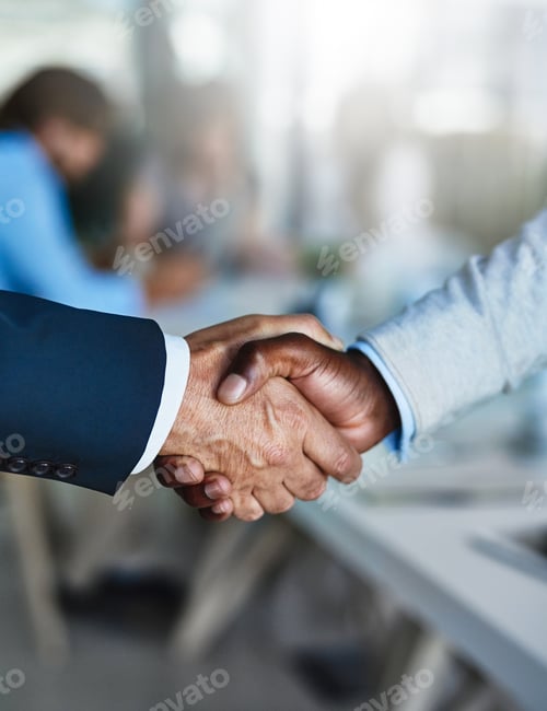 Preview: Cropped shot of two businessmen shaking hands during a meeting at work