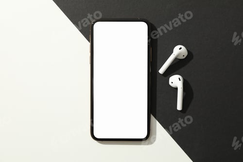 Preview: Phone with empty screen and headphones on black - white background, top view