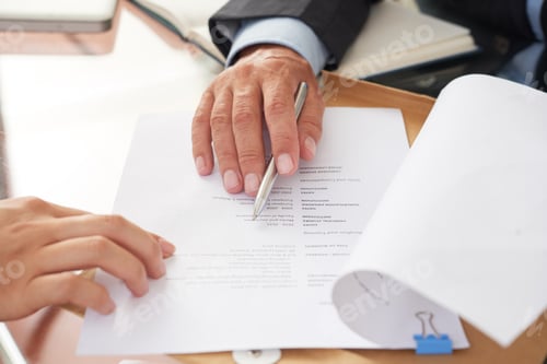 Preview: People examining business resume