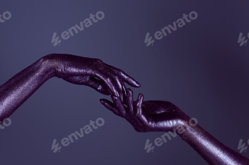 Preview: partial view of womens hands in ultra violet glitter touching each other, isolated on purple