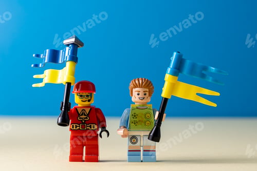 Preview: Lego little men with flags of Ukraine. A minifigure toy man holding a blue flag. Support of the