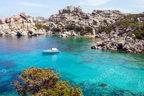 Preview: Lonely boat in picturesque bay in Sardinia