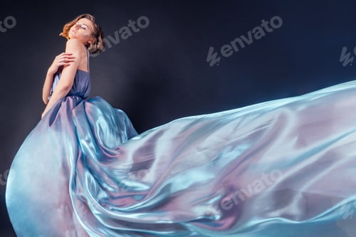 Preview: full height sensual and beautiful woman in gray blue waving sparkling dress