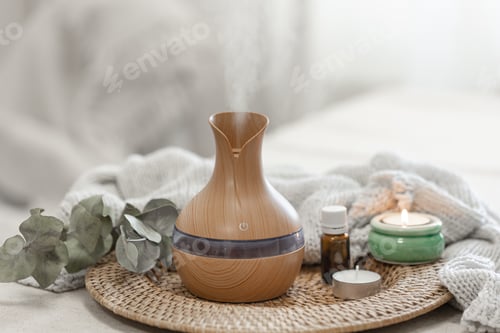Preview: Spa composition with aroma oil diffuser lamp on a blurred background.