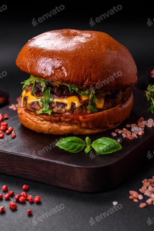Preview: Burger with juicy beef cutlet, cheese, tomatoes, salt, spices and herbs