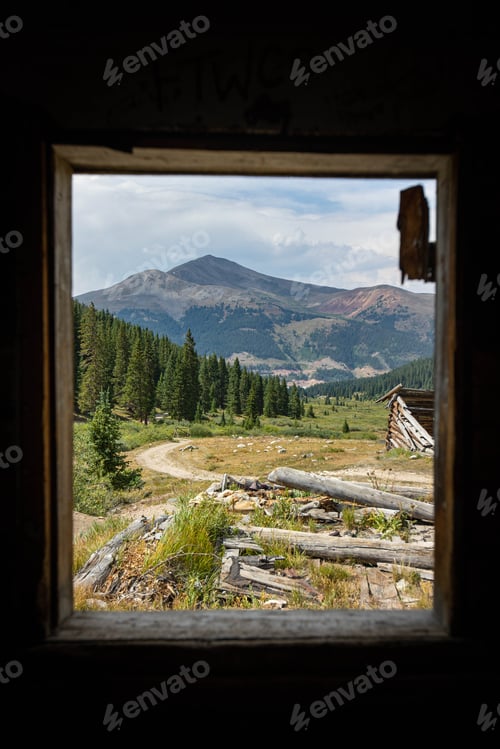 Preview: Mountain landscape view from inside a cabin window