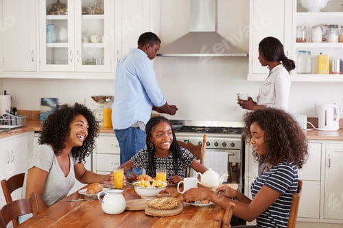 Preview: Family With Teenage Children Eating Breakfast In Kitchen