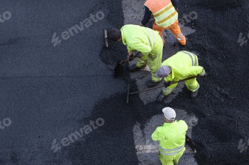 Preview: Workers during Asphalting Road Work on city street