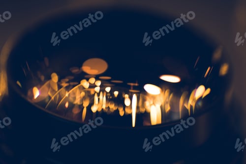 Preview: close-up shot of garland lights reflecting in camera lens