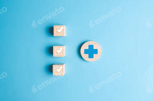 Preview: Plus and check mark icons on wooden blocks for medical and health care concept