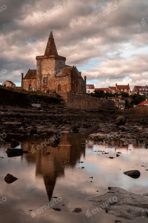 Preview: Castle stands on a rocky beach by the ocean