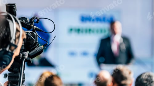 Preview: Media Event. Cameraman With Headphones Recording Speaker