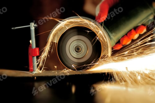 Preview: Worker cutting metal with grinder