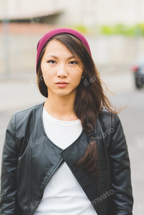 Preview: portrait of asian beautiful young woman looking in camera serious