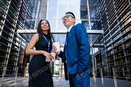 Preview: Joyful Hispanic lady taking break talking to partner