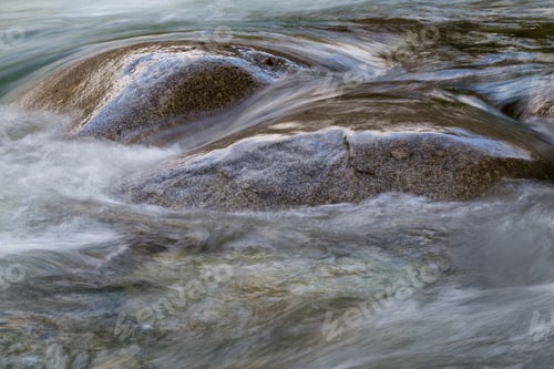 Preview: Flowing water around the soft rocks. Nature Background