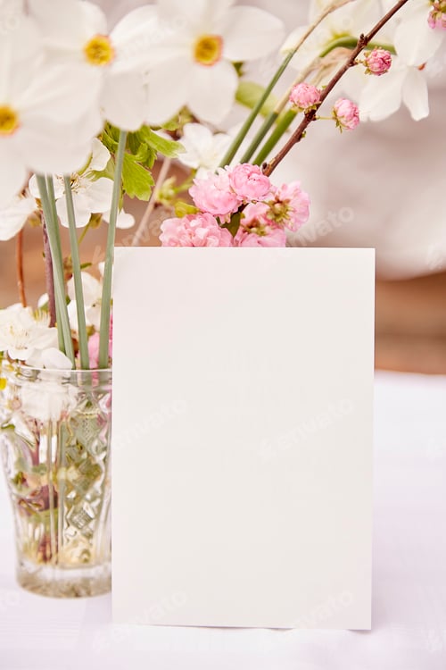 Preview: Rustic spring postcard mock up with vase of spring pink, white and yellow flowers.