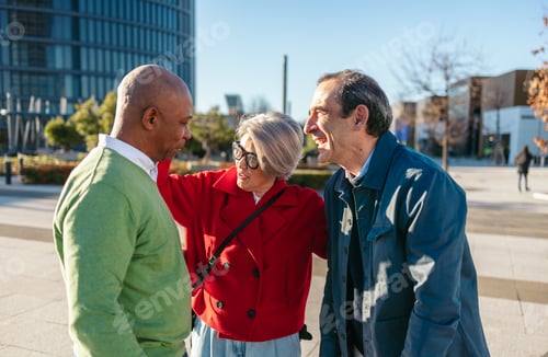 Preview: Three mature friends enjoying time together outdoors, laughing and connecting in an urban setting