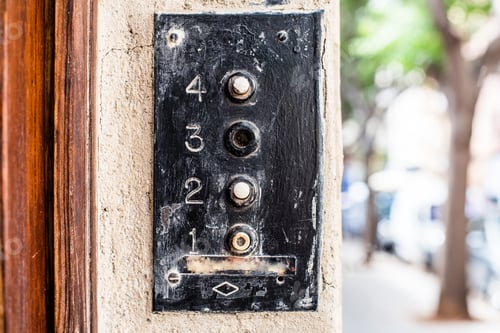 Preview: Vintage old intercom on a street of a big city
