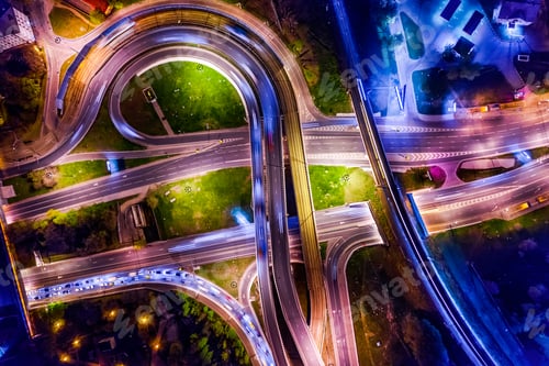 Preview: Night Aerial view of a freeway intersection traffic trails in ni