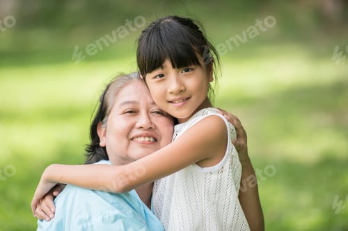 Preview: Elderly grandmother in wheelchair with granddaughter in the hospital garden