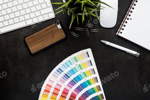 Preview: Graphic designer work space with black desk, top view