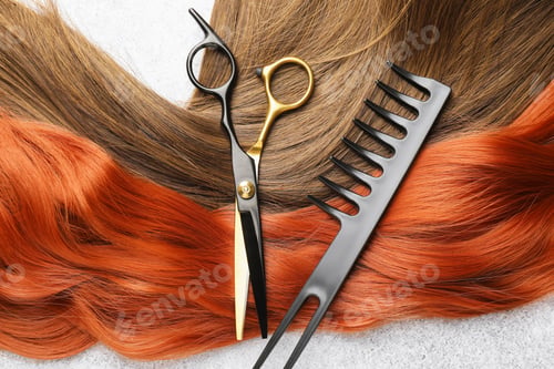 Preview: Beautiful hair strands in different colors and hairdresser's tools on light background, flat lay