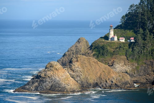 Preview: Scenic view of Heceta Head Lighthouse on the Oregon coast with rocky cliffs and the Pacific Ocean