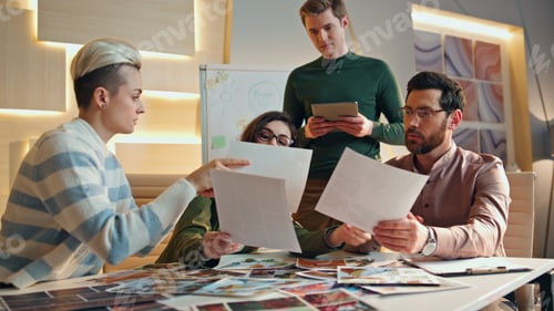 Preview: Woman presenting business strategy to men colleagues in office boardroom closeup