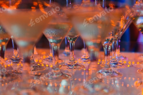 Preview: Champagne glasses standing in a tower at the party