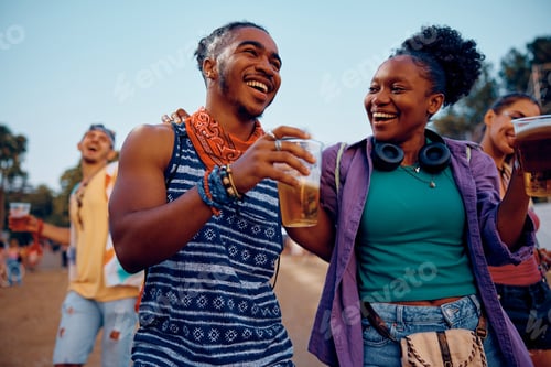 Preview: Happy African American couple having fun on summer music festival.