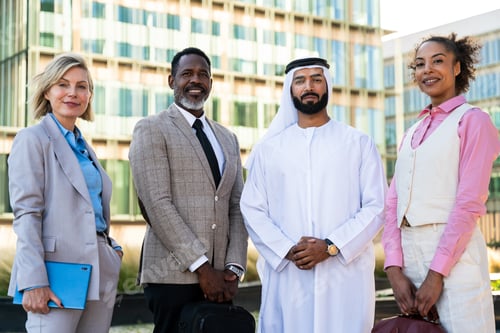 Preview: Group of multiethnic business people meeting an emirati businessman