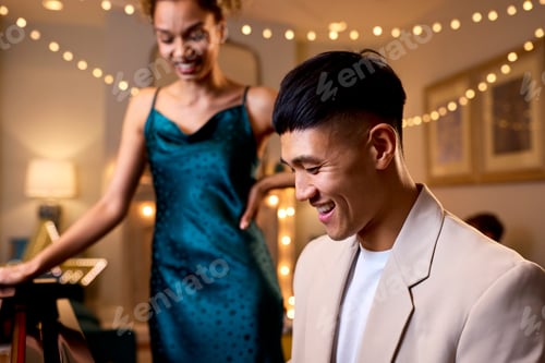 Preview: Couple Around Piano Celebrating At Christmas Or New Year Party Together