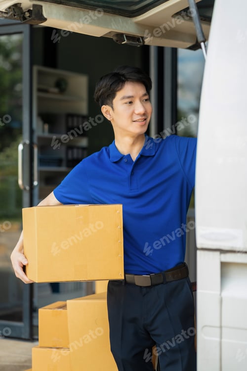 Preview: Asian delivery man work in truck for checking the product in the truck, concept ecommerce.