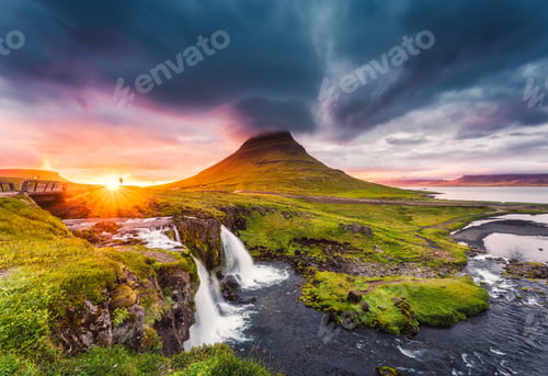 Preview: Landscape of sunset over Kirkjufell mountain with Kirkjufellsfoss waterfall and pileus cloud