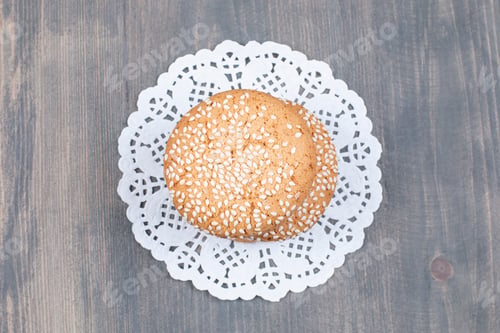 Preview: Cookies with sesame seeds on wooden surface