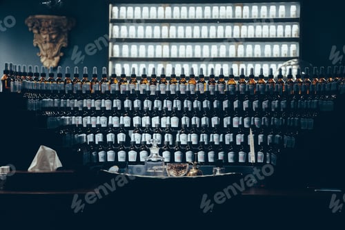 Preview: Pattern of perfume bottles displayed on a table. Luxury. Tailored cologne.