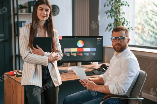 Preview: Creative job. Two designers are working together in the modern office