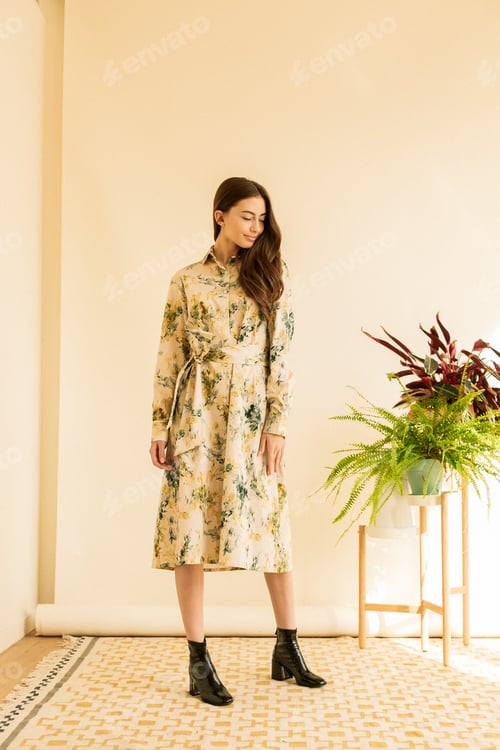 Preview: Beautiful young elegant woman brunette in long dress high heels. Date or party