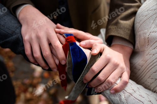 Preview: Celtic wedding. Groom and bride tied hands