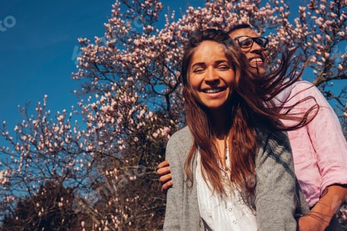 Preview: Happy young couple embracing in park