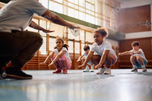 Preview: Black schoolgirl and her classmates having physical education class with sports teacher.