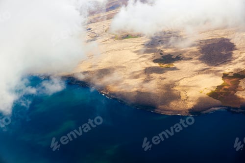 Preview: View from above of Land and ocean with clouds in summer