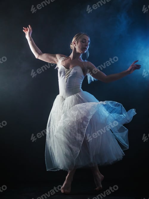 Preview: Ballerina is practicing her moves in dark studio