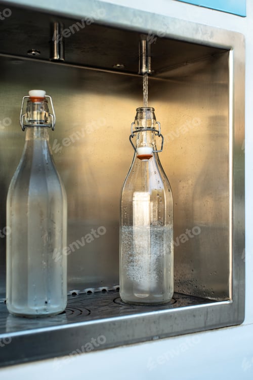 Preview: Mineral Water machine on the street. Pay and load drinking water